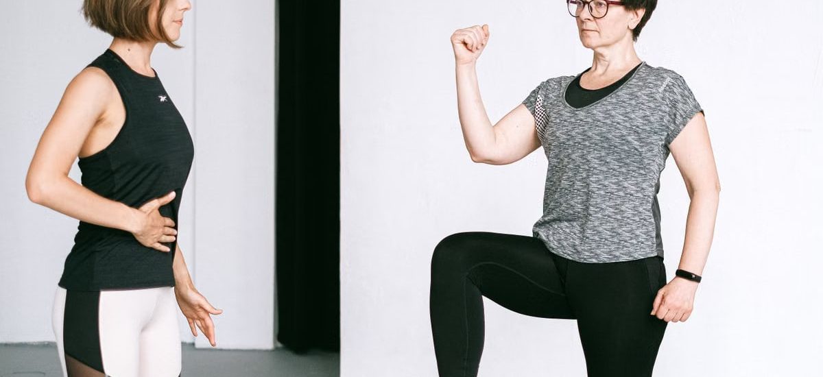 Two women working out together, demonstrating fitness exercises on a white background.